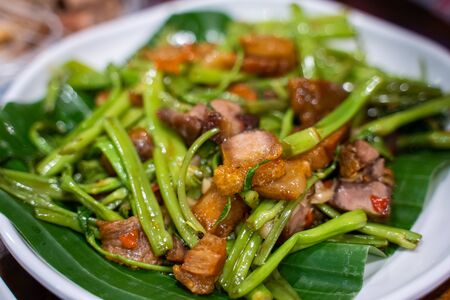 stir fried morning glory with crispy pork,Thai foodの写真素材