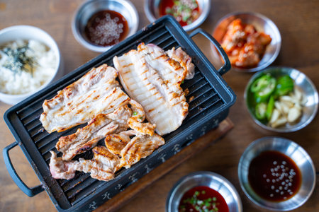 grilled slice poek with charcoal stove,korean barbecueの写真素材