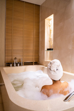 women soak in warm water bathtub,bathtubの写真素材