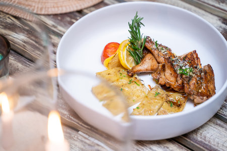 Pollo Alla Graiglia grilled chicken with baked potatoes,Italian foodの写真素材