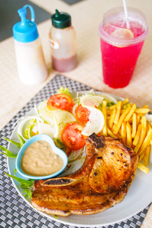 porkchop steak with french fries and salad,steakの写真素材