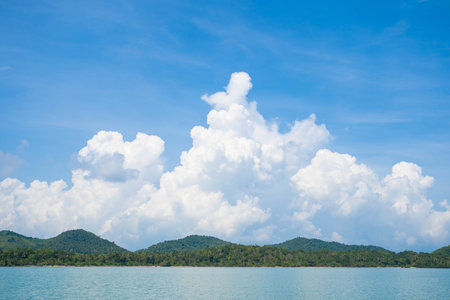 Sky and fluffy clouds at sunny day, sunlightの写真素材