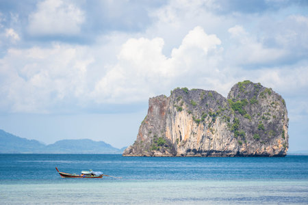 Thai traditional wooden longtail boat on tropical sea, transportationの写真素材