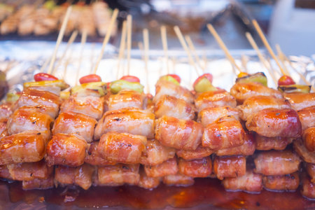 Bacon Wrapped Sausage with barbecue sauce,sausageの写真素材