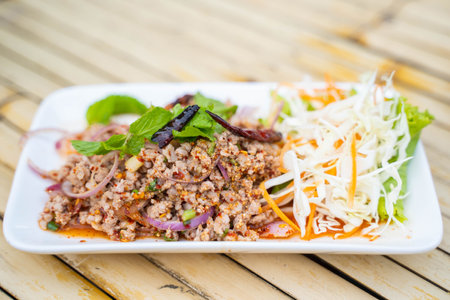 Spicy minced pork salad Isaan food,diningの写真素材