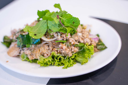 Spicy minced pork salad Isaan food,diningの写真素材