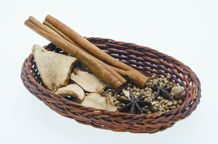 Spices in basket on a white backgroundの写真素材
