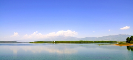Beautiful landscape with the island being reflected in waterの写真素材