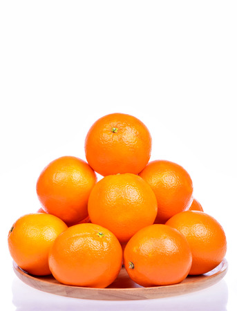 Many fresh raw orange isolated on white backgroundの写真素材