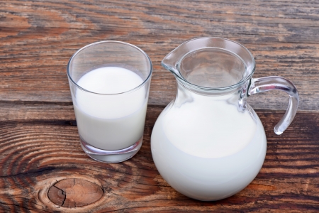Glass jug and glass with milkの写真素材