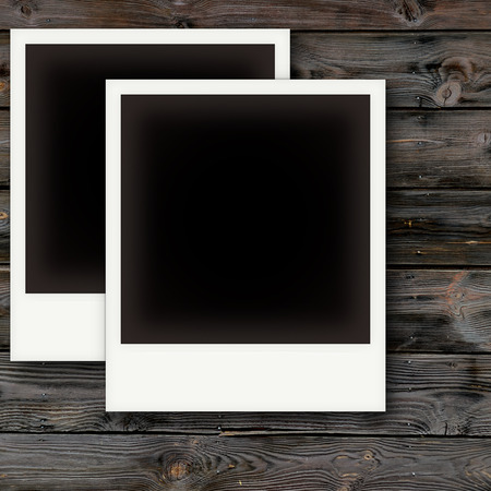Vintage photo frames on wooden board