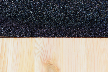 Workplace and tools of a carpenter or builder-background sandpaper and wood surfaceの写真素材