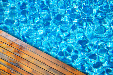 Swimming pool and wooden deck for backgrounds