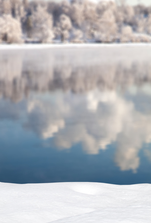Winter landscape-forest reflected in the lakeの写真素材