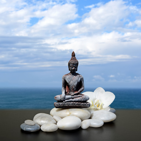 Feng-Shui background-Buddha,zen stone,white orchid flowers, sea and skyの写真素材