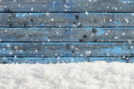 Old wooden background with snowfall and snowdrift