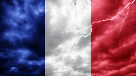 French flag against dark sky, clouds and lightningの写真素材