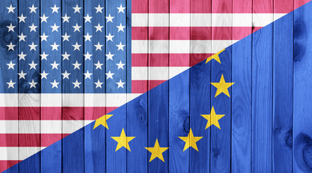 European union flag and American flag on white wood texture backgroundの写真素材