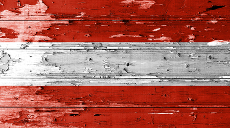 Austria flag on wood texture background with old paint peelsの写真素材