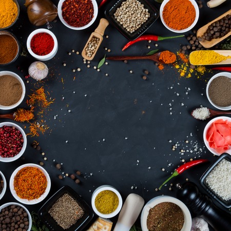 Large set of asian spices, herbs, vegetables on black backgroundの写真素材
