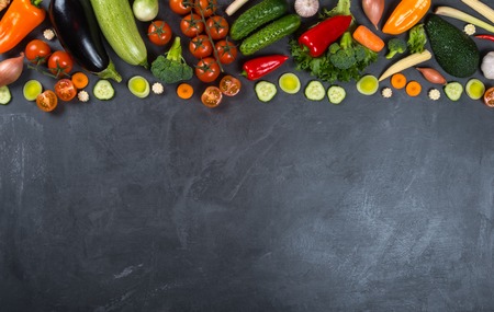 Big set of fresh vegetables on a black backgroundの写真素材