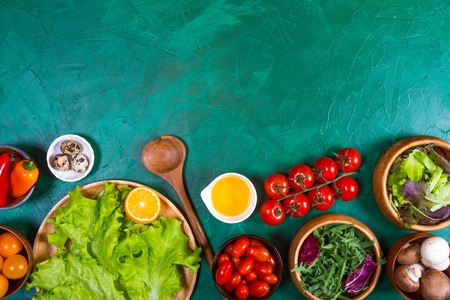 Organic vegetables for dietary catering on green backgroundの写真素材