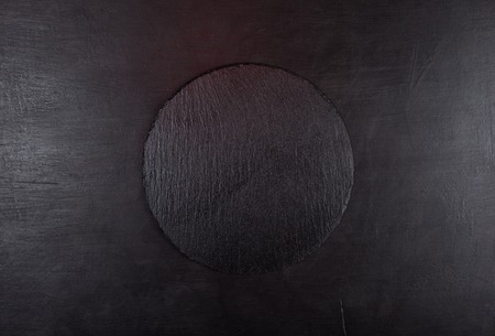 Black background with black round stone tray for product presentationの写真素材