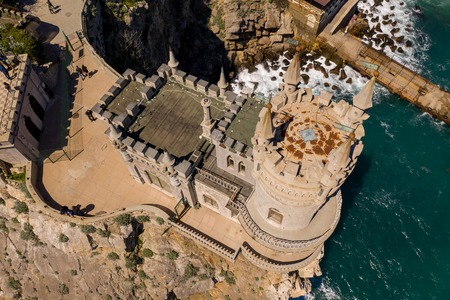 Yalta, Crimea - April 21, 2019: Tourists examine and take pictures on the background of the famous...
