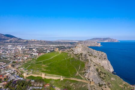 Panoramic aerial shot of Genoese fortress in Sudak at sunsetの写真素材