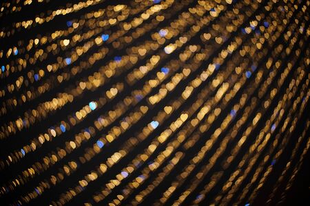 Golden and blue hearts bokeh lights. Beautiful valentines day background