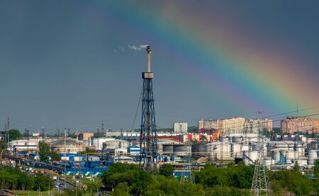 Beautiful rainbow over a petrochemical plant.の写真素材