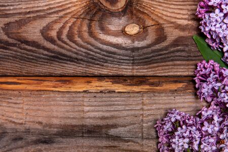 Bouquet of lilac on a old wooden background. Top viewの写真素材