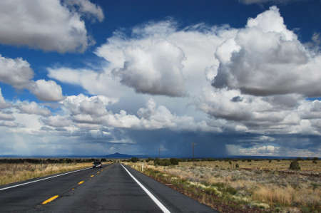 Straight Highway with Rain Shower in Coloradoの写真素材