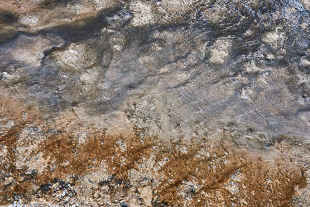 silver brown and grey Earth colored by bacteria in Yellowstone Park