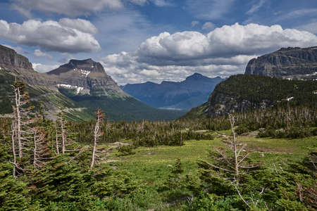 View over valley with mountains in Glaciers National Park Montanaの写真素材