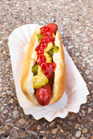 Fresh Hot Dog with ketchup and mustard on paper trayの写真素材