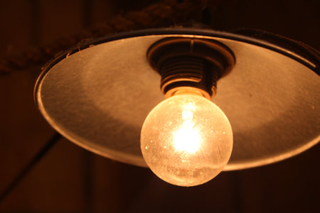 Vintage Light Bulb in the dark, closeup of photo