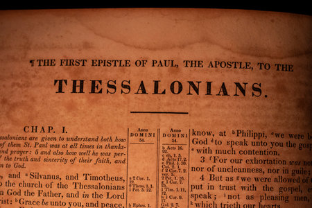Close up of the word Jesus in an old Holy Bible book.