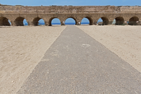 The ancient viaduct on the Mediterranean Sea. Israel.の写真素材