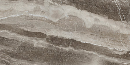 Close-up of a marble wall featuring elegant brown and white stripes, showing the natural beauty of the stone.の写真素材