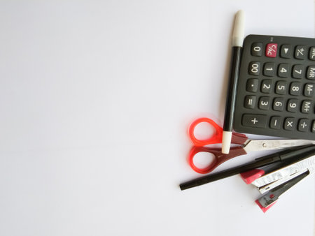 office supplies, calculator, pens, markers, staples, scissors with copy paste area great for quotes, advertising, commercialの写真素材