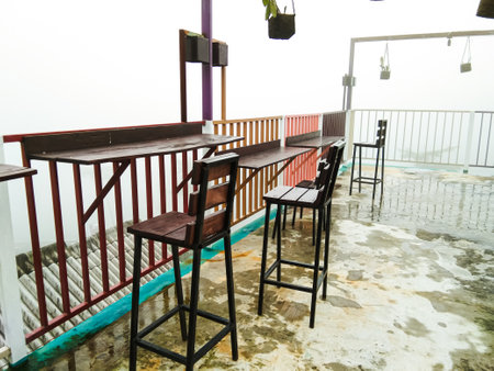 chairs and tables at an outdoor cafe in the bromo mountain areaの写真素材