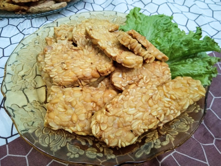fried tempeh on top of blond with lettuceの写真素材
