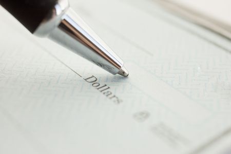 Pen writing dollar amount on check の写真素材