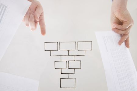 top performance flow: hands gesturing toward blank flow chart on transparent surface 
