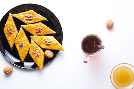 Traditional Arabic dessert. Baklava with walnuts, cardamom and honey. Homemade Turkish pastries.の写真素材