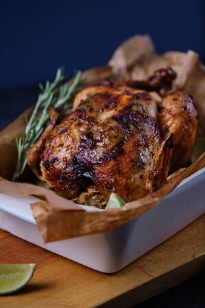 Chicken baked in the oven with spices, lemon, herbs and young potatoes.の写真素材