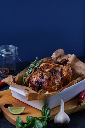 Chicken baked in the oven with spices, lemon, herbs and young potatoes.の写真素材