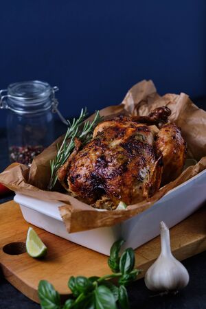 Chicken baked in the oven with spices, lemon, herbs and young potatoes.の写真素材