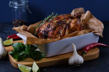 Chicken baked in the oven with spices, lemon, herbs and young potatoes.の写真素材